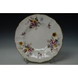 A contemporary Royal Crown Derby plate, having gilt scalloped edge and floral decorated in the '