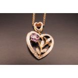 A contemporary silver gilt openwork heart shaped pendant, together with two yellow metal neck