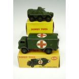 A boxed Dinky 626 military ambulance together with a boxed Dinky 676 armoured personnel carrier