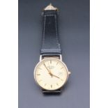 A Rotary 9 ct gold quartz wristwatch, having a circular champagne face with baton markers,