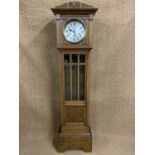 An oak grandmother clock, having a spring driven three-train movement, circa 1930s - 1940s, 182 cm