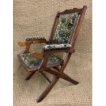 A Victorian upholstered mahogany folding chair