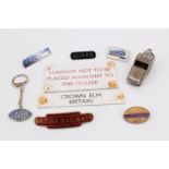 An LNER railway guard's pea whistle, together with a British Railway enamelled cap badge, a