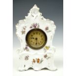 An early 20th century rococo influenced German porcelain mantle clock, 19.5 cm, (a/f)