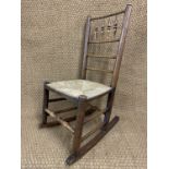 A Victorian Lancashire style rush-seated spindle-back rocking chair