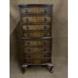 An old reproduction Georgian walnut chest-on-chest, of diminutive stature, 66 cm x 54 cm x 133 cm