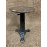 A late 19th / early 20th Century Singer sewing machinist's cast iron based stool