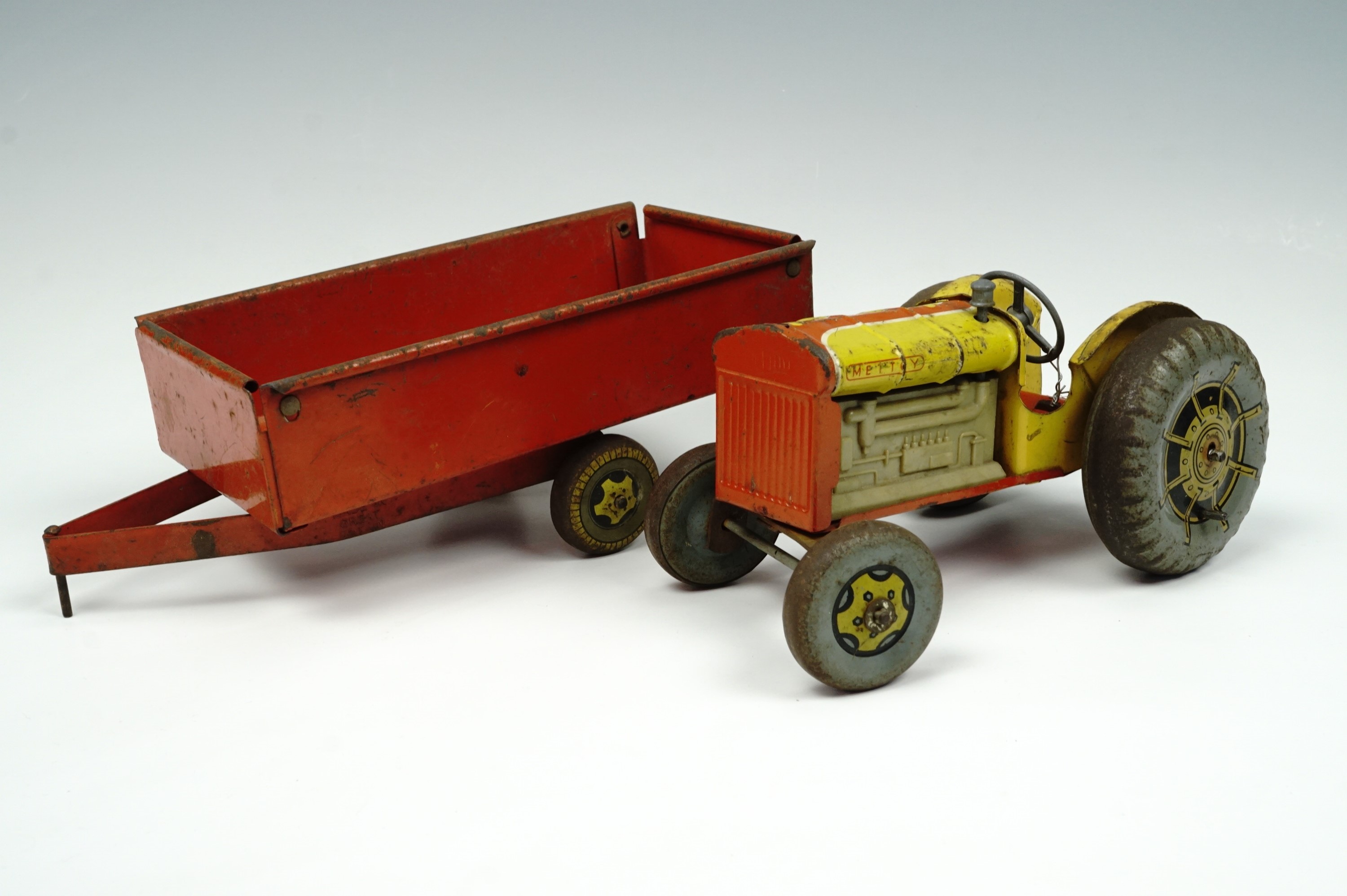 A Mettoy tinplate tractor and trailer, mid 20th century - Image 2 of 2