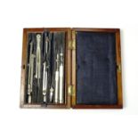 A cased set of British military draughtsman's drawing instruments, circa 1940s