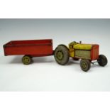 A Mettoy tinplate tractor and trailer, mid 20th century