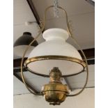 A late 19th / early 20th Century pendant brass oil lamp, with milk glass shade, approximately 70
