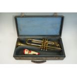 Cased 1950s Grafton brass trumpet, serial number 50714, with a Styratone mute.