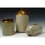A stoneware flagon together with a stoneware hot water bottle and a jar