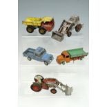 Five vintage play-worn Dinky toys including a tractor, a flat bed truck etc