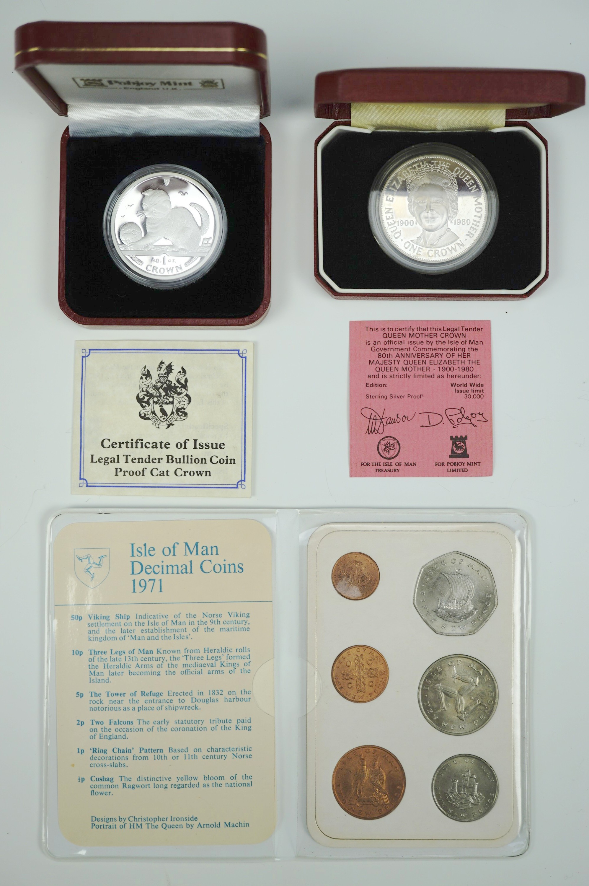 Two Isle of Man silver proof crowns together with a 1971 year set