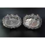 A pair of Victorian neo-Baroque silver shallow dishes or waiters, each cast and engraved in a