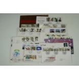 A small quantity of GB first day stamp covers together with a related book