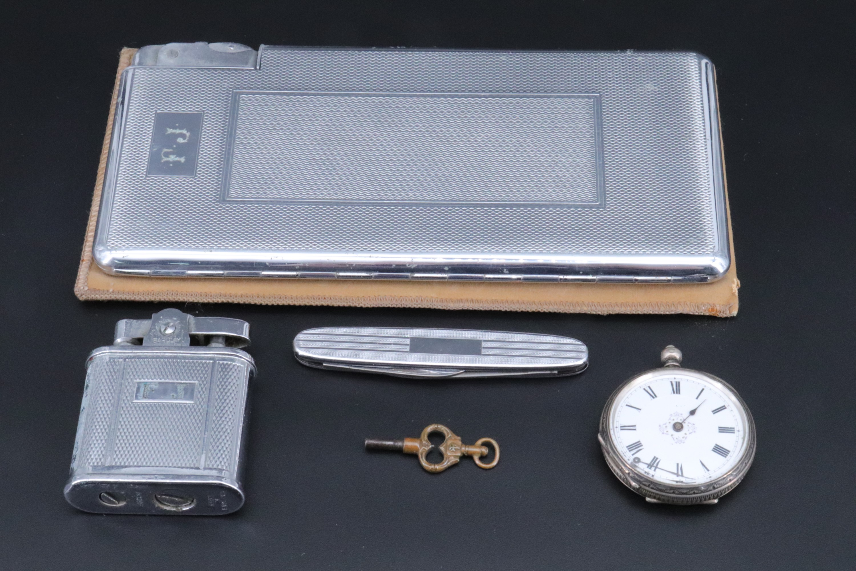 A Kingcraft chromium plated combined cigarette case and lighter, circa 1950s, together with a