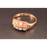 A late Victorian 15 ct gold pearl and coral ring, comprising two lines of four stones divided by a
