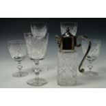 Four Edinburgh Crystal wine glasses together with a electroplate mounted glass claret jug and a