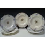 Five mid 19th century Royal Worcester soup plates, white body with raised blue decoration to the
