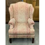 A reproduction George III wing back armchair
