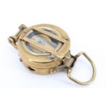 A military style brass lensatic marching compass