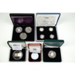 Commemorative coins including a Pobjoy Mint £5 Titanium Tuppeny Blue coin, a Malta Millennium Lm5