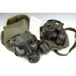 Two late 20th Century British military gas masks and related kit