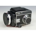 A cased Rolleiflex SL66 SLR camera, having a Zeiss !:2.8 80 mm lens, with accessories