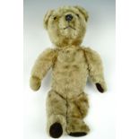A mid 20th century articulated mohair Teddy bear with a growler, a/f, 50 cm