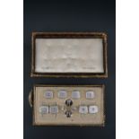 A vintage cased set of Art Deco influenced cuff links and shirt studs in seed pearl, mother of pearl
