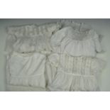 Four vintage christening gowns