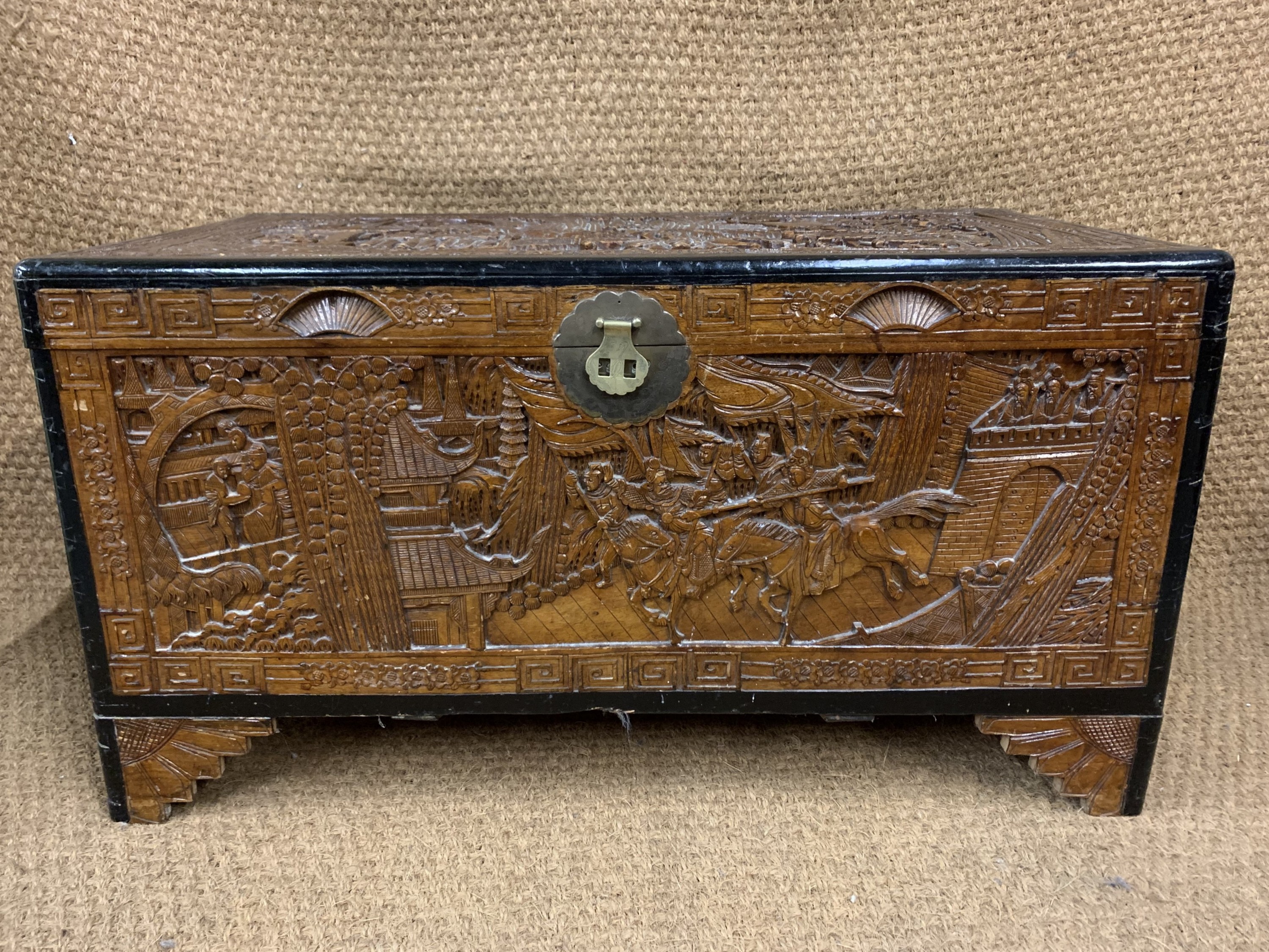A 20th Century Chinese carved camphor wood chest, 100 cm x 54 cm x 53 cm
