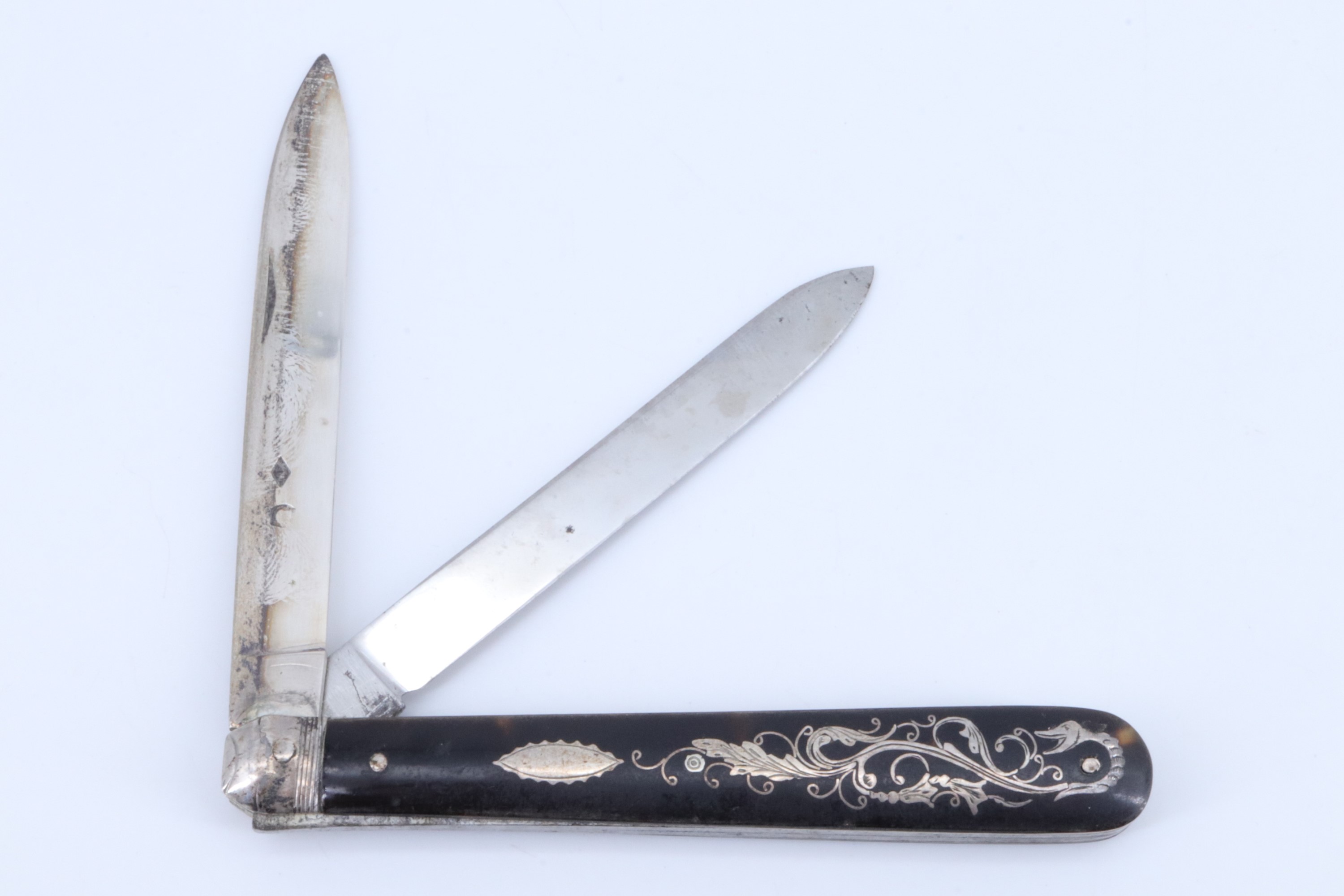 A fine 19th Century European pocket folding knife, having two blades, respectively in white metal