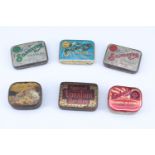 A group of early 20th Century printed tinplate gramophone needle tins and needles