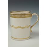 A Victorian straight sided porcelain tankard, having a white body and reticulated gilt decoration,