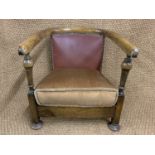 A 1930s child's horseshoe-backed tub armchair, 60 cm high