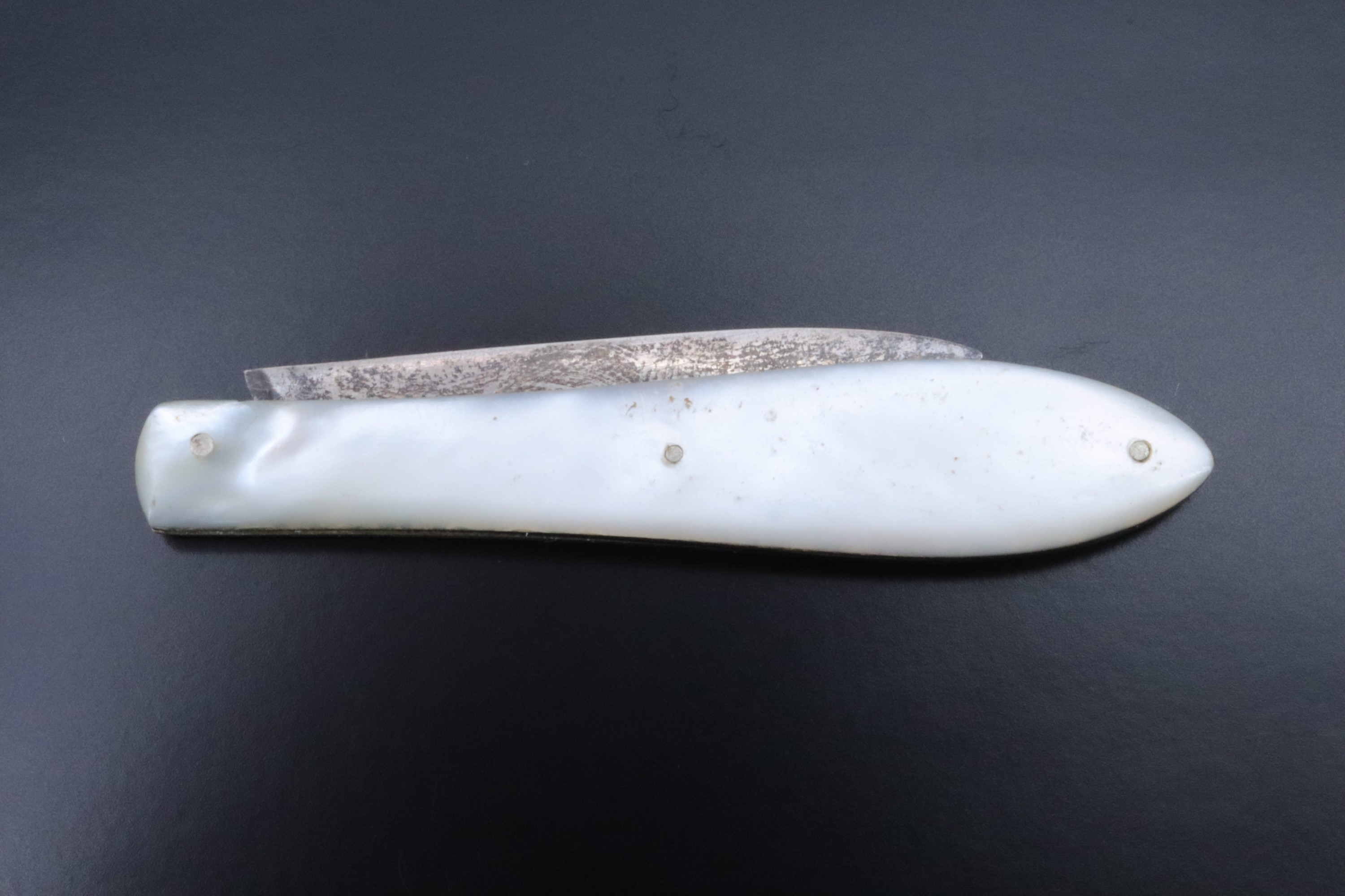A Victorian pocket folding fruit knife, having mother-of-pearl grip scales and a silver blade, - Image 2 of 3