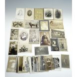 A group of Victorian cabinet cards, a carte de visite and later photographs including studies of a