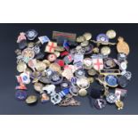 A large quantity of lapel badges and buttons etc, military and other