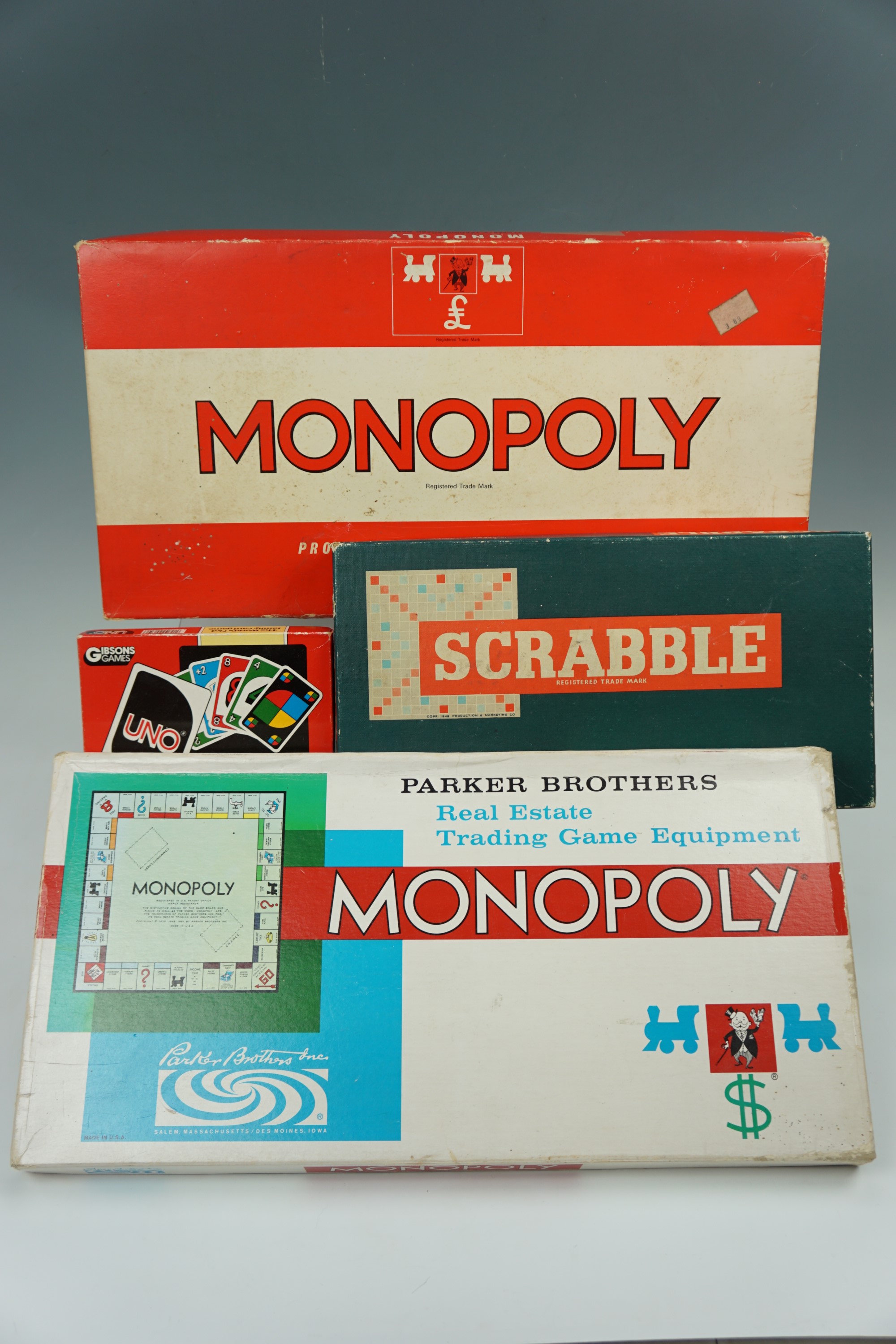 Vintage board games comprising two Monopoly games, Scrabble and Speers Snakes and Ladders