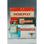 Vintage board games comprising two Monopoly games, Scrabble and Speers Snakes and Ladders