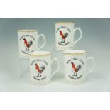 Four commemorative mugs, "While I Live, I Crow, Dalston 2000"