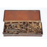 A large quantity of 19th century and later watch, clock and other keys in a leather box