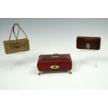 A leather purse with embossed lid on long straps, a lady's brown leather coin purse by Finnigans Ltd