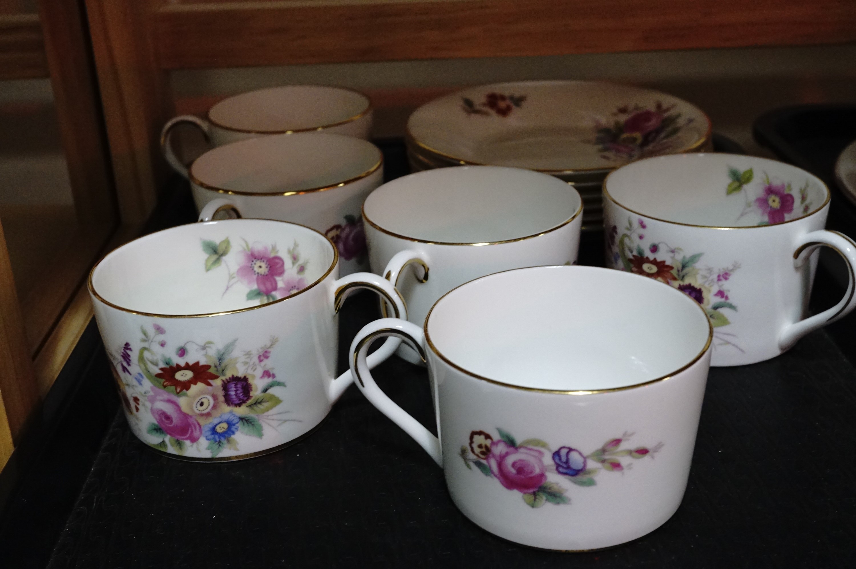 Six Coalport 'Junetime' teacups and saucers, white body with polychrome floral decoration inside and - Image 2 of 2