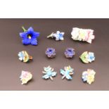 A small group of vintage and later porcelain flowerhead and enamelled floral jewellery