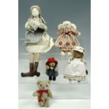 Three handmade cloth dolls, a miniature articulated Teddy and a Paddington Bear toy.