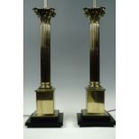 A pair of large brass columnar table lamps, 73 cm to socket